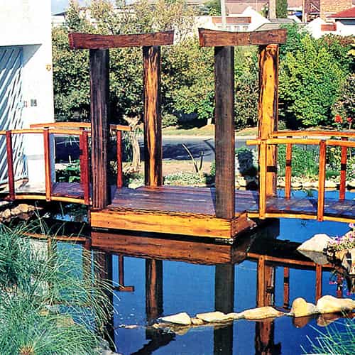 A Japanese style bridge over a pond